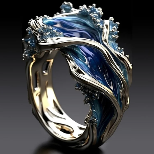 Anillo vintage dorado con ondas oceánicas